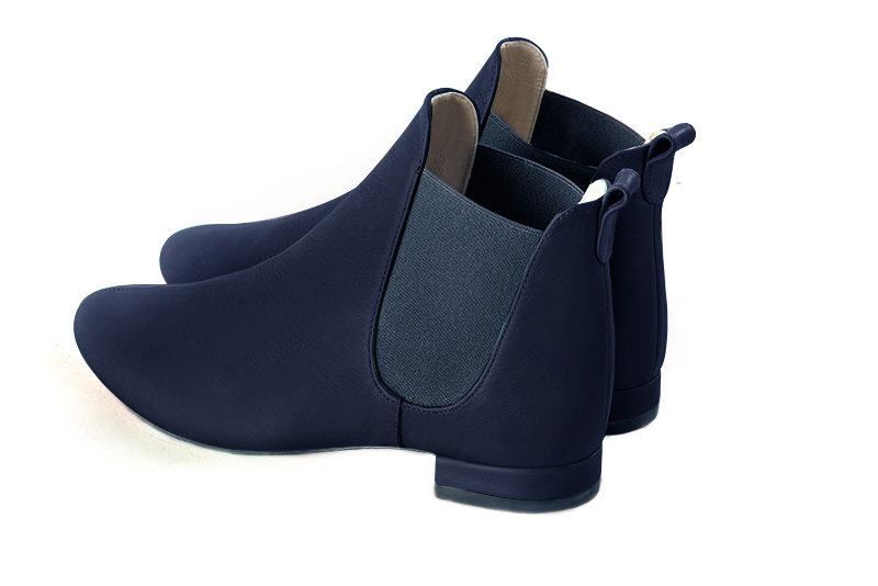 Navy blue women's ankle boots, with elastics. Round toe. Flat block heels. Rear view - Florence KOOIJMAN